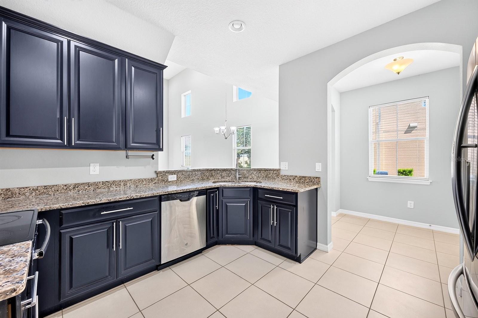 The Kitchen is both beautiful and functional, featuring 42-INCH CABINETRY, GRANITE COUNTERTOPS AND STAINLESS STEEL APPLIANCES.