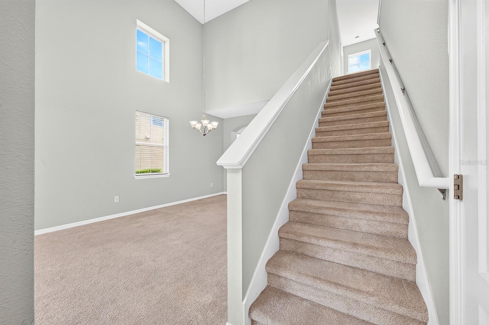 Head up the stairs to the Flexible Loft space and 2 more Bedrooms.