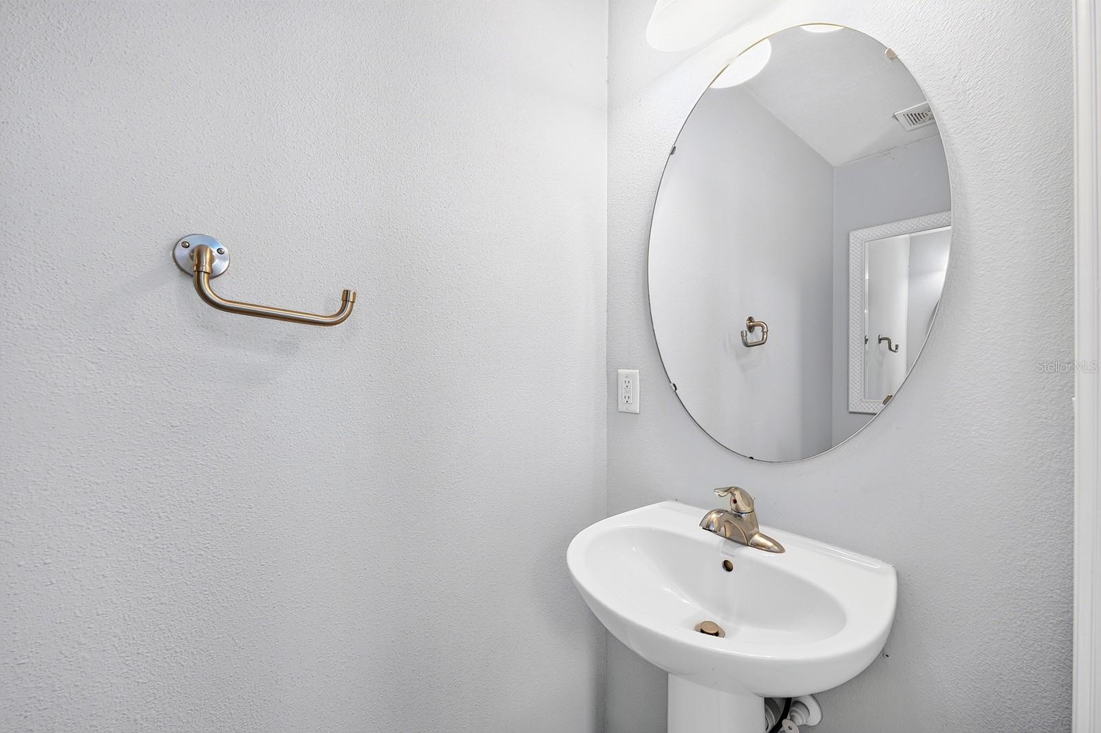 A convenient Half Bath serves guests and family.