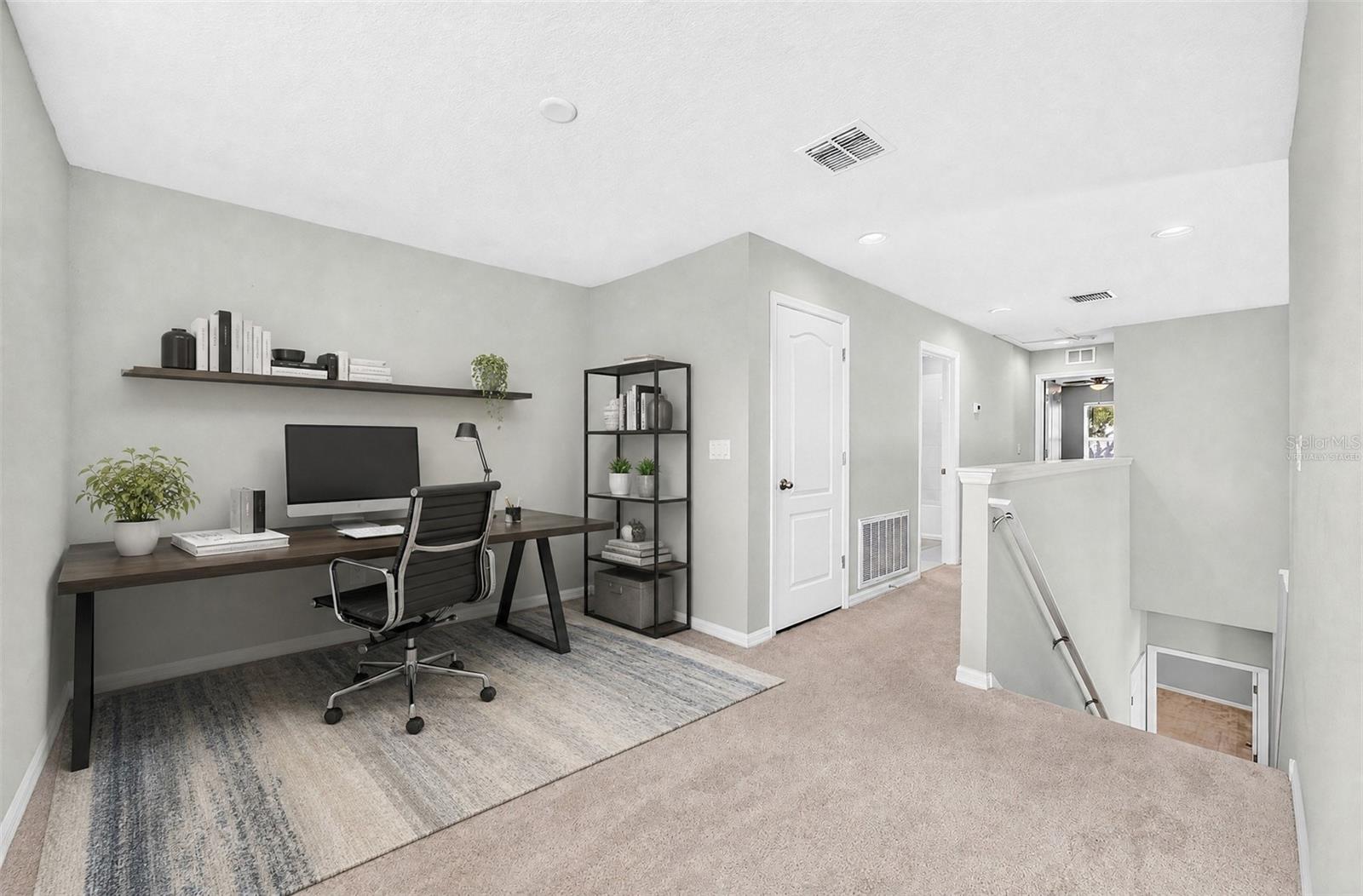Upstairs, a VERSATILE LOFT provides additional living space that can easily accommodate a home office, reading area, media space or playroom. Virtually Staged