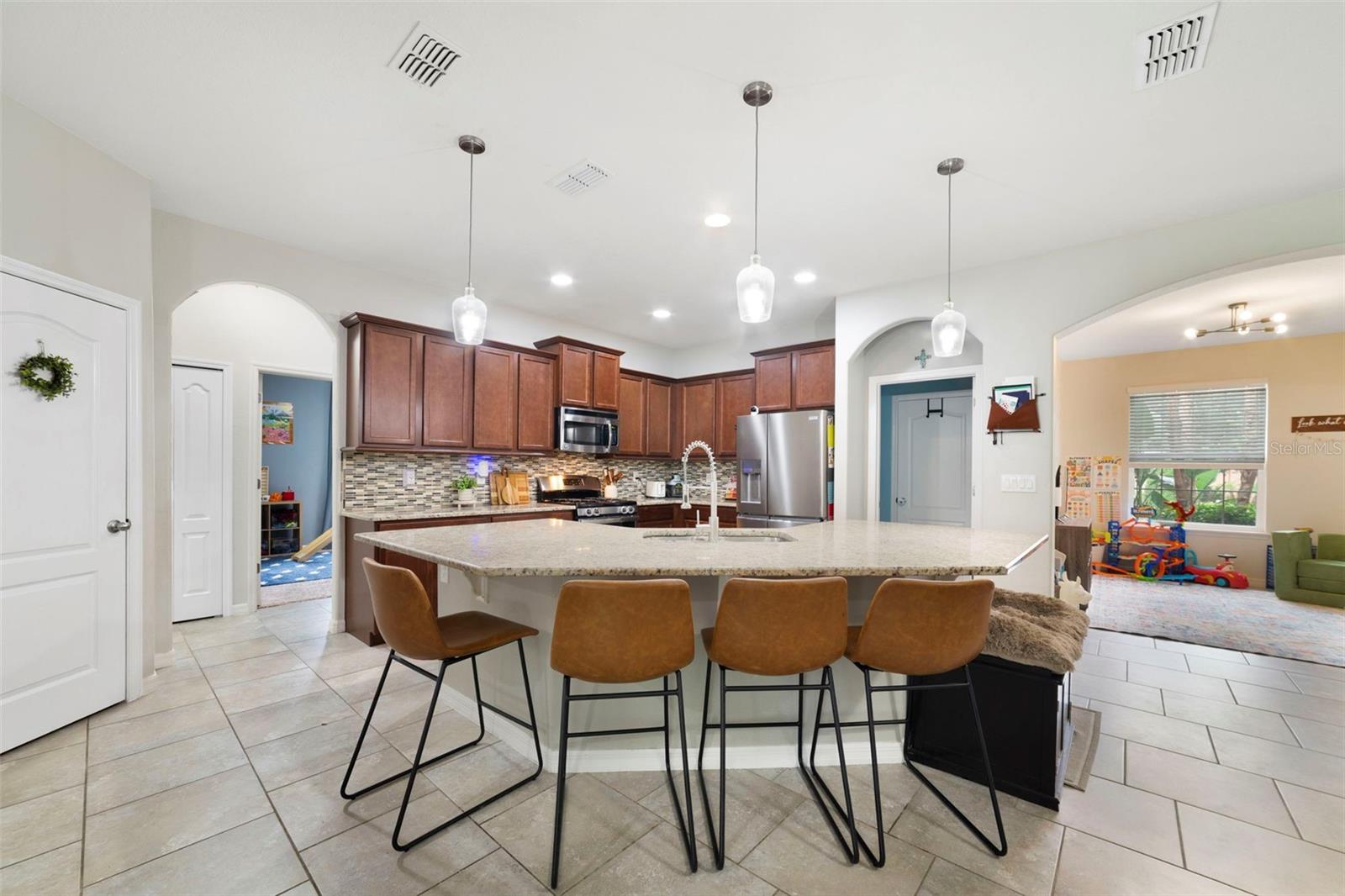 Kitchen is open to the living and dining areas.