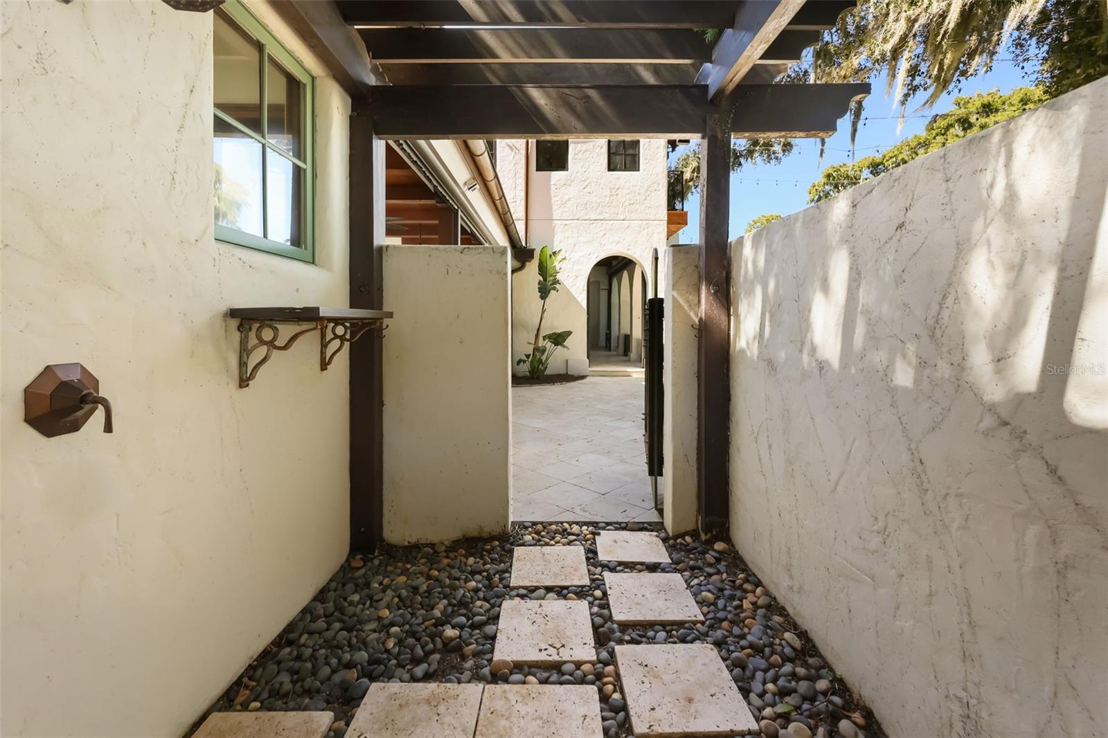 Outdoor shower outside of primary bathroom