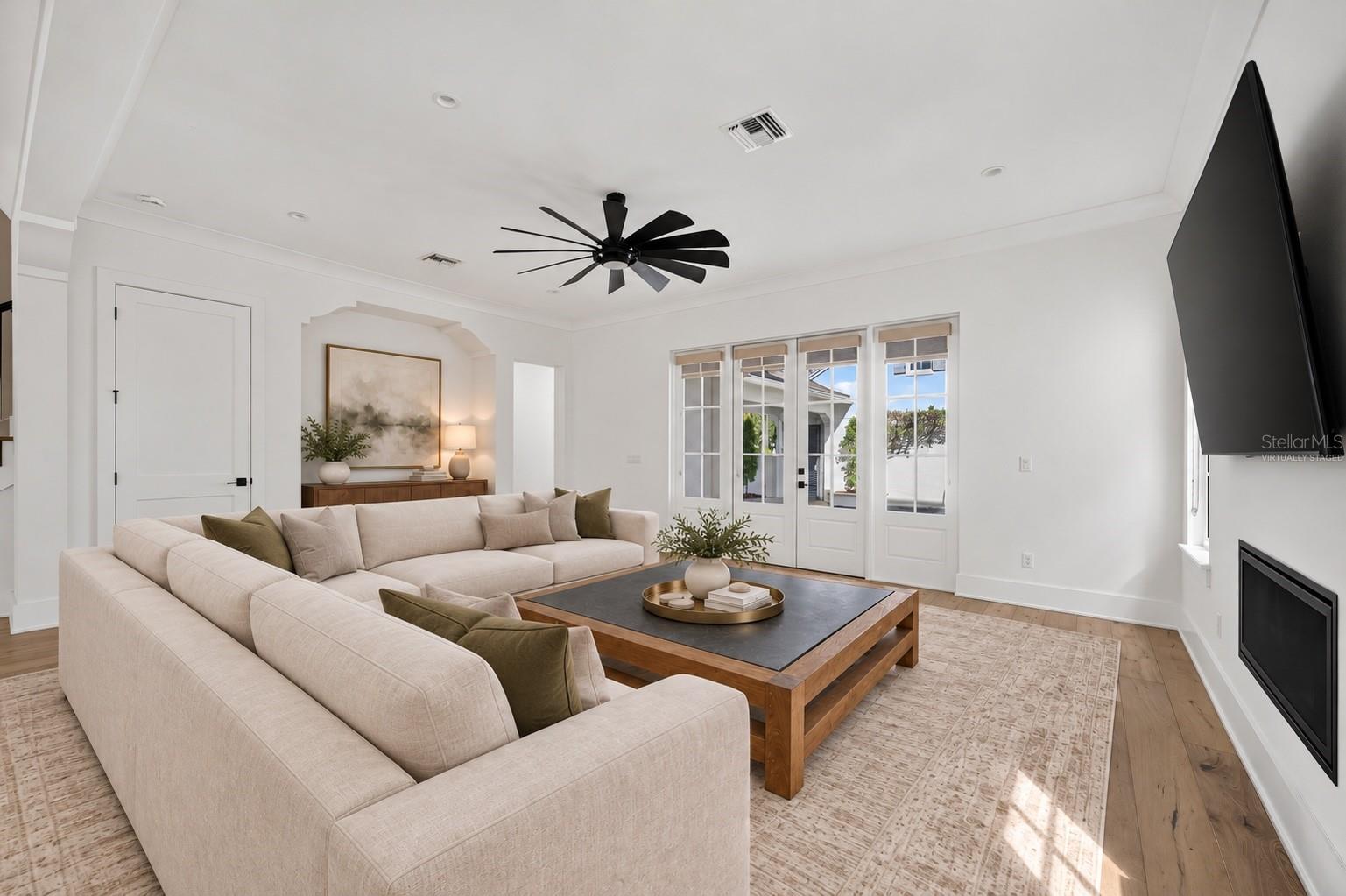 Living room overlooking the courtyardVirtually Staged