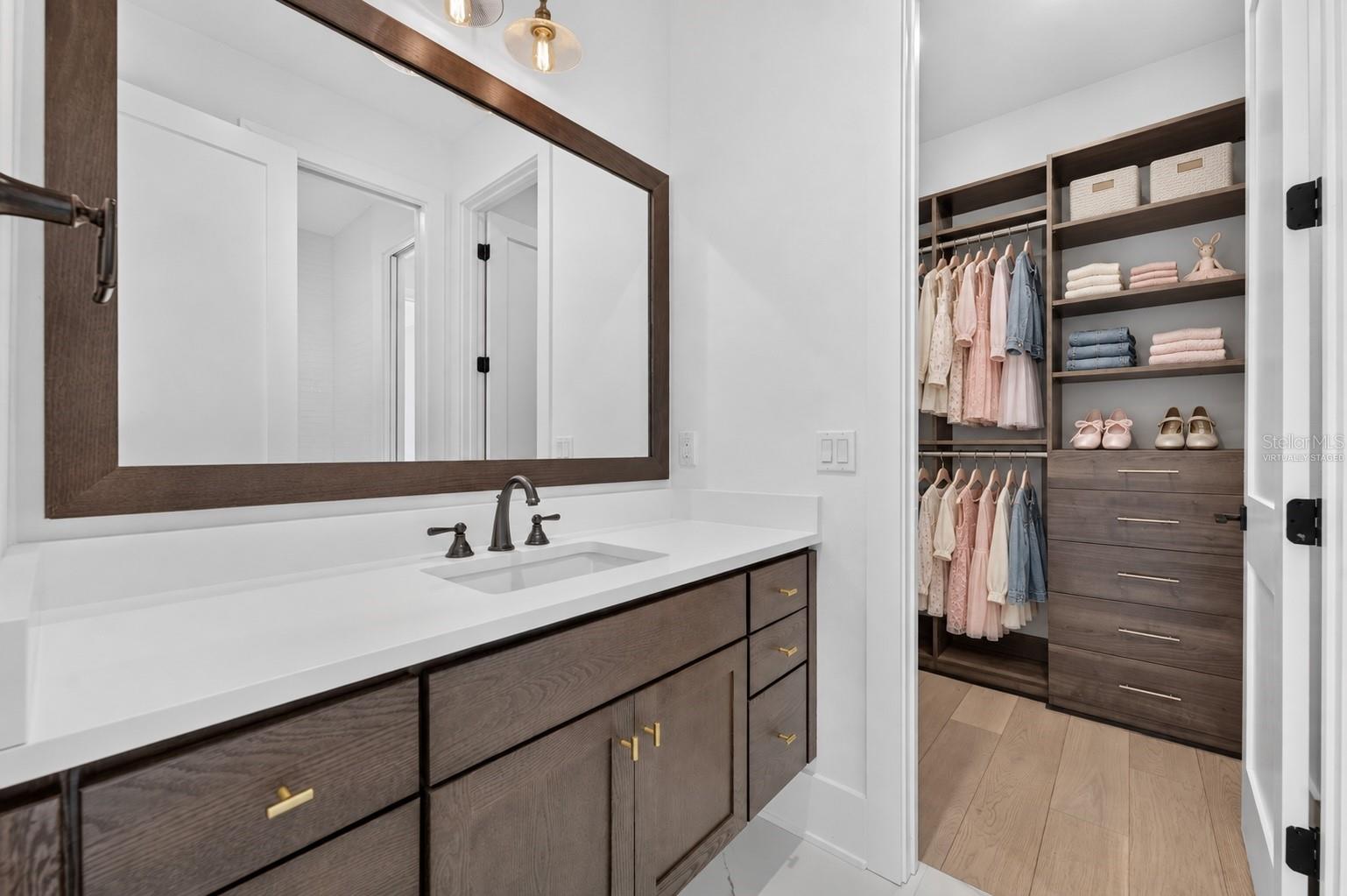 Bedroom 3 - private vanity and walk-in closetVirtually Staged