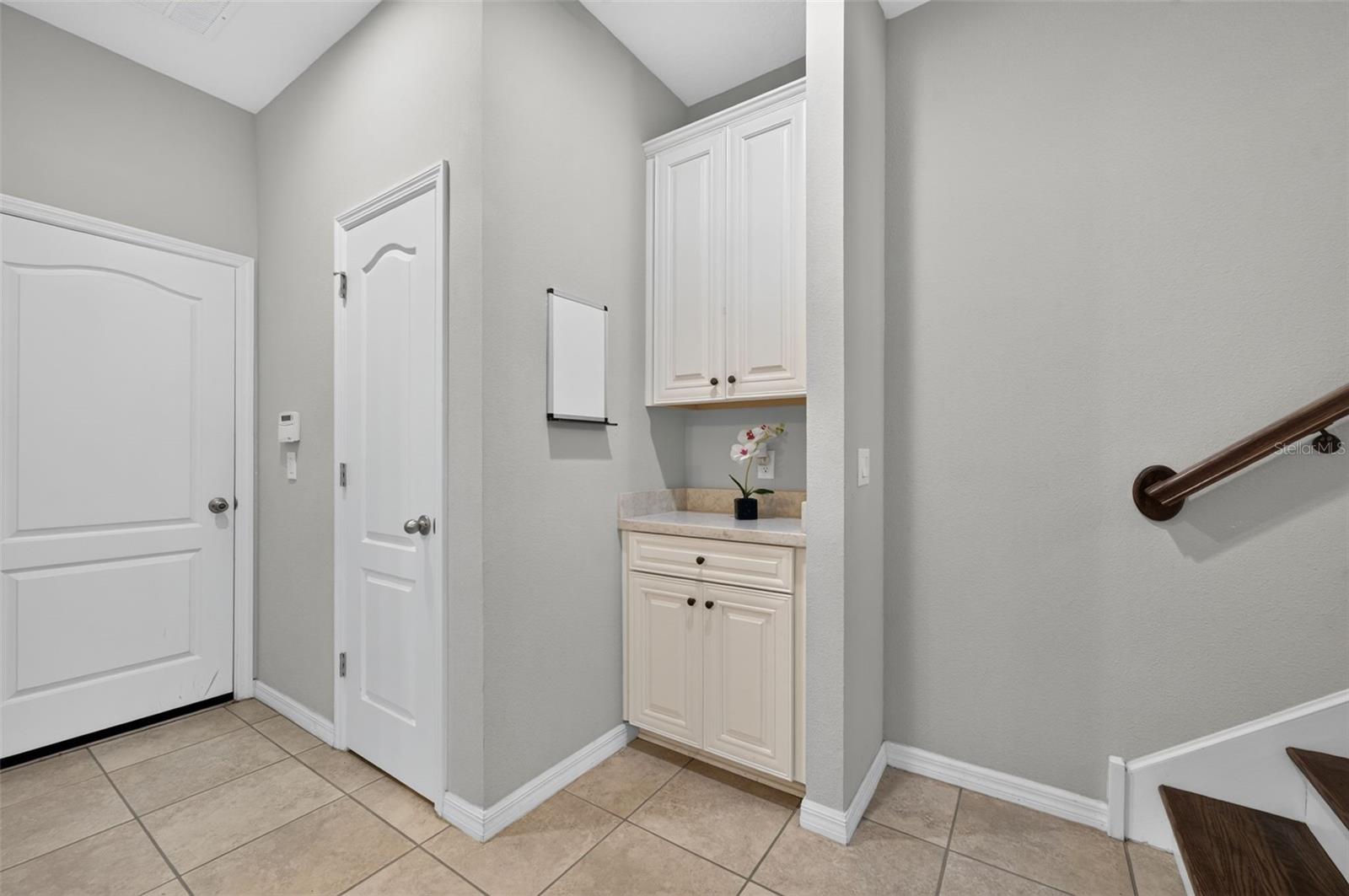 Drop zone on the first floor, by closet and garage entry door.