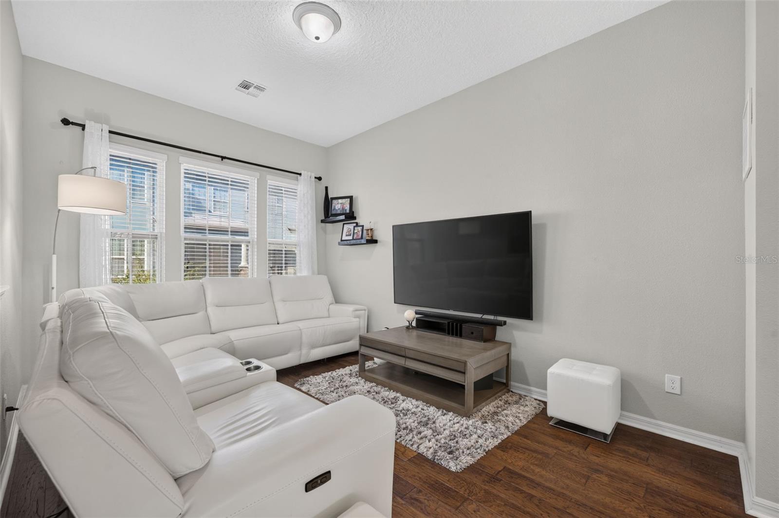 The family room is open to the kitchen and dining room area