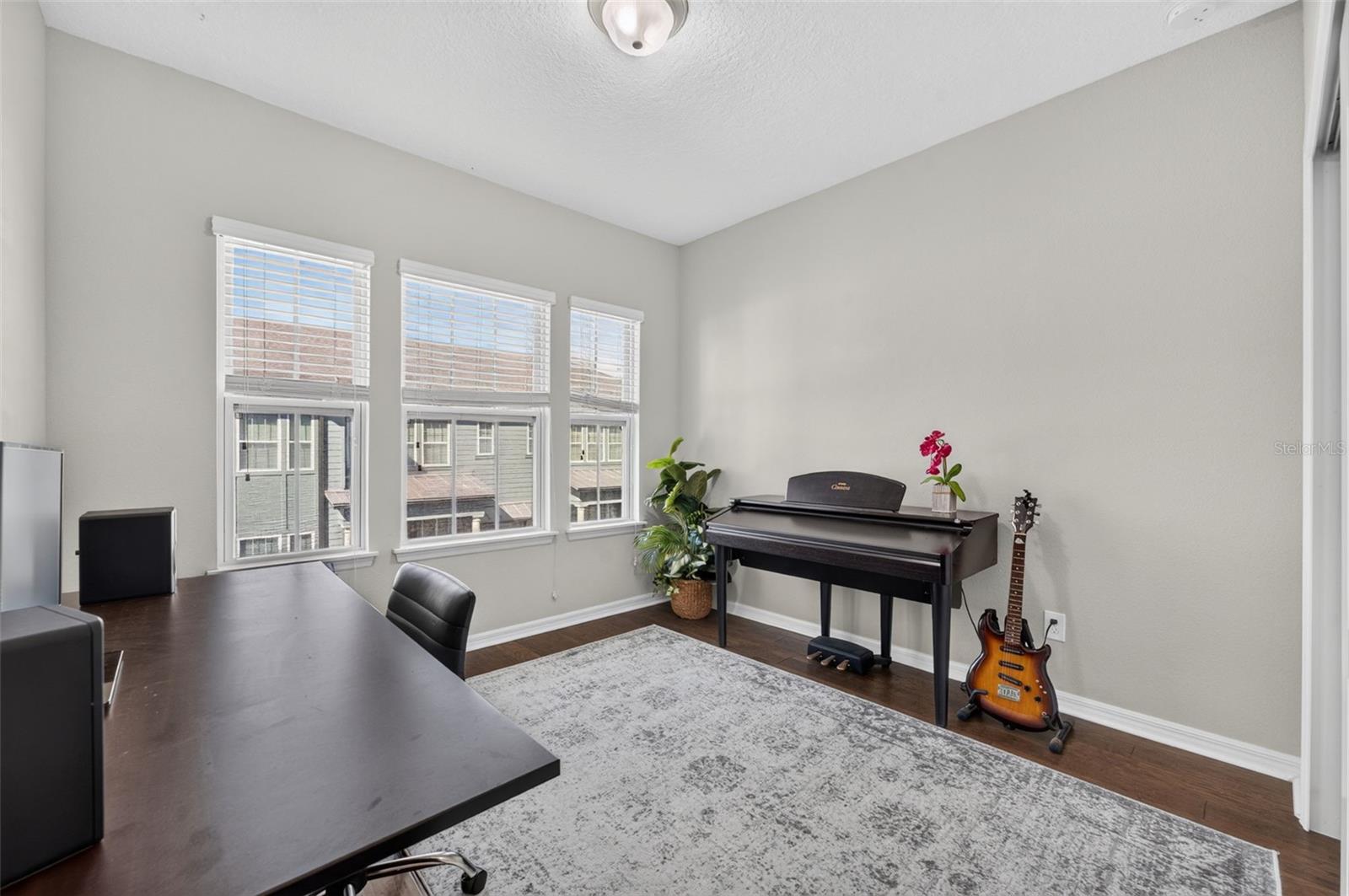 Secondary Bedroom features laminate wood floors