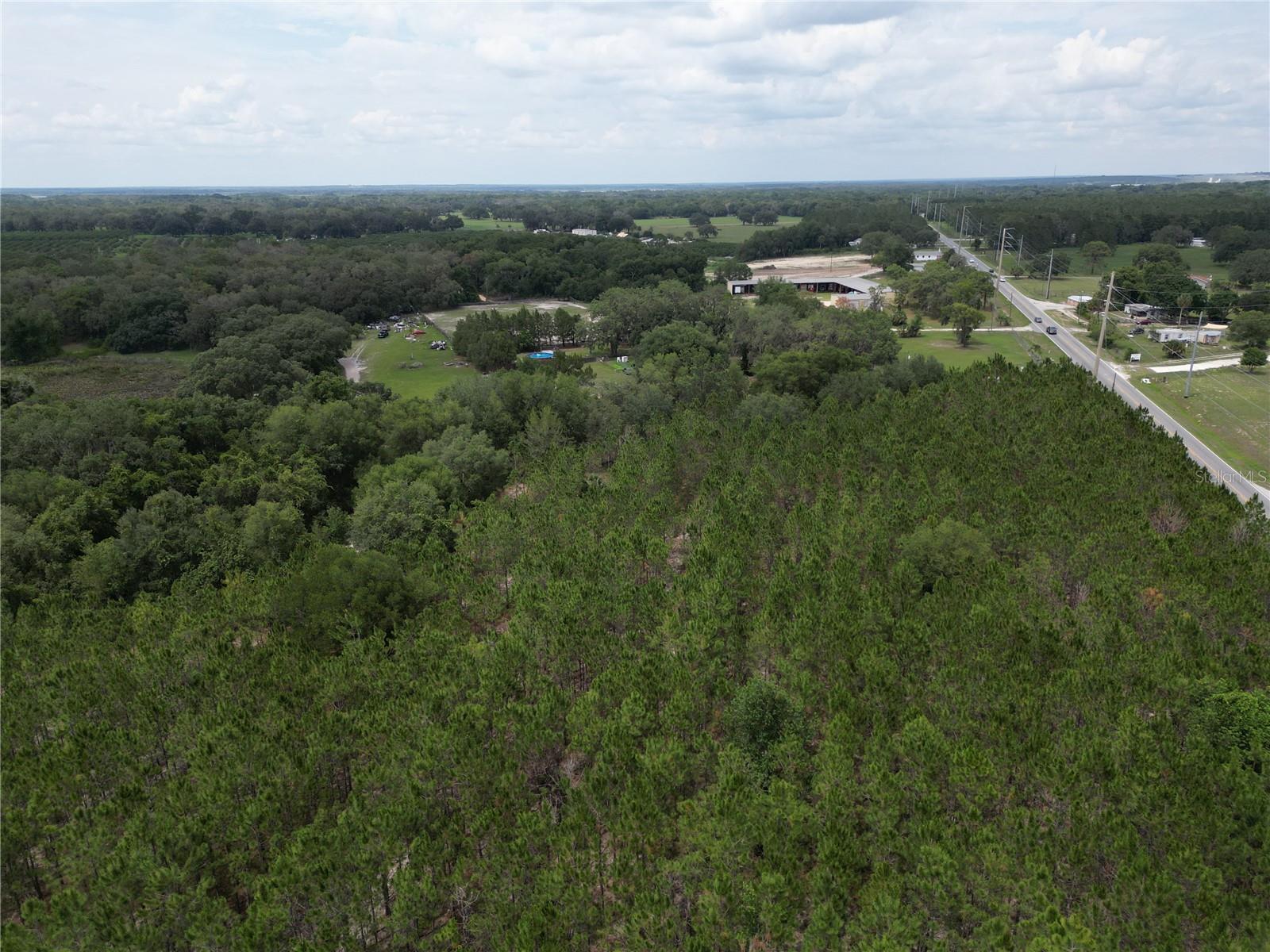 An aerial photo of the site from the northeastern corner, oriented northeast.