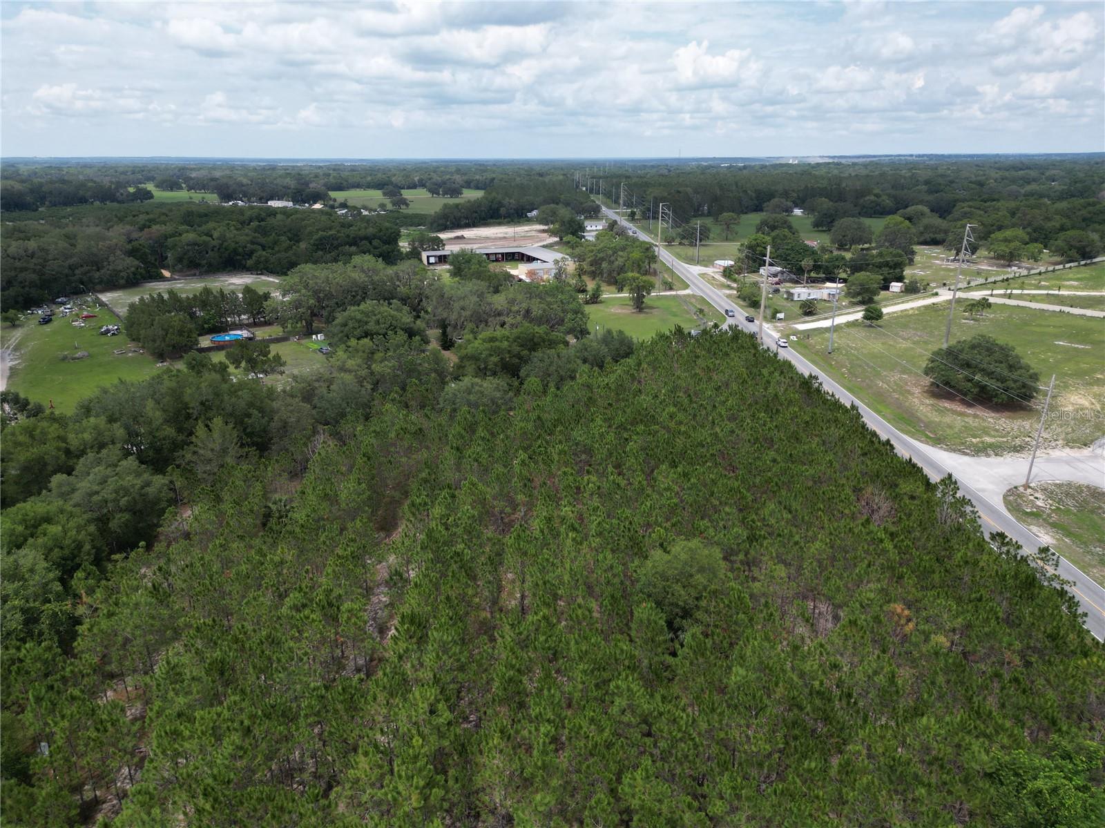 An aerial photo of the site from the northeastern corner, oriented northeast.