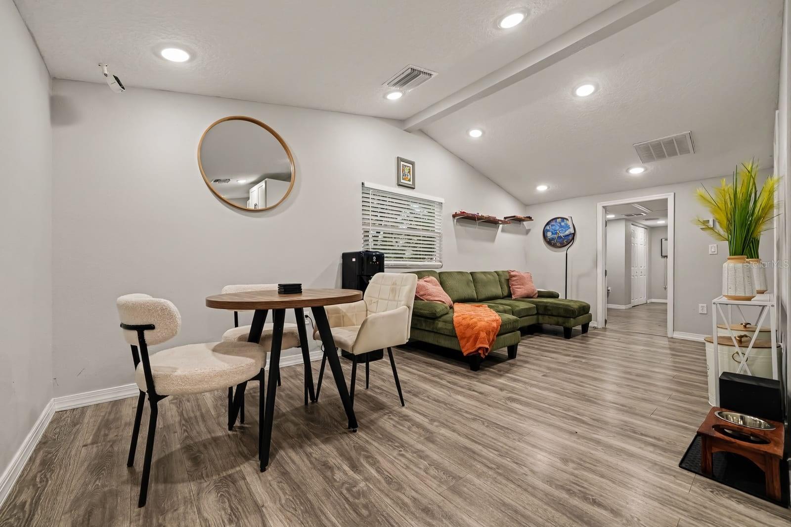 Spacious great room offering dining and lounge areas with modern finishes