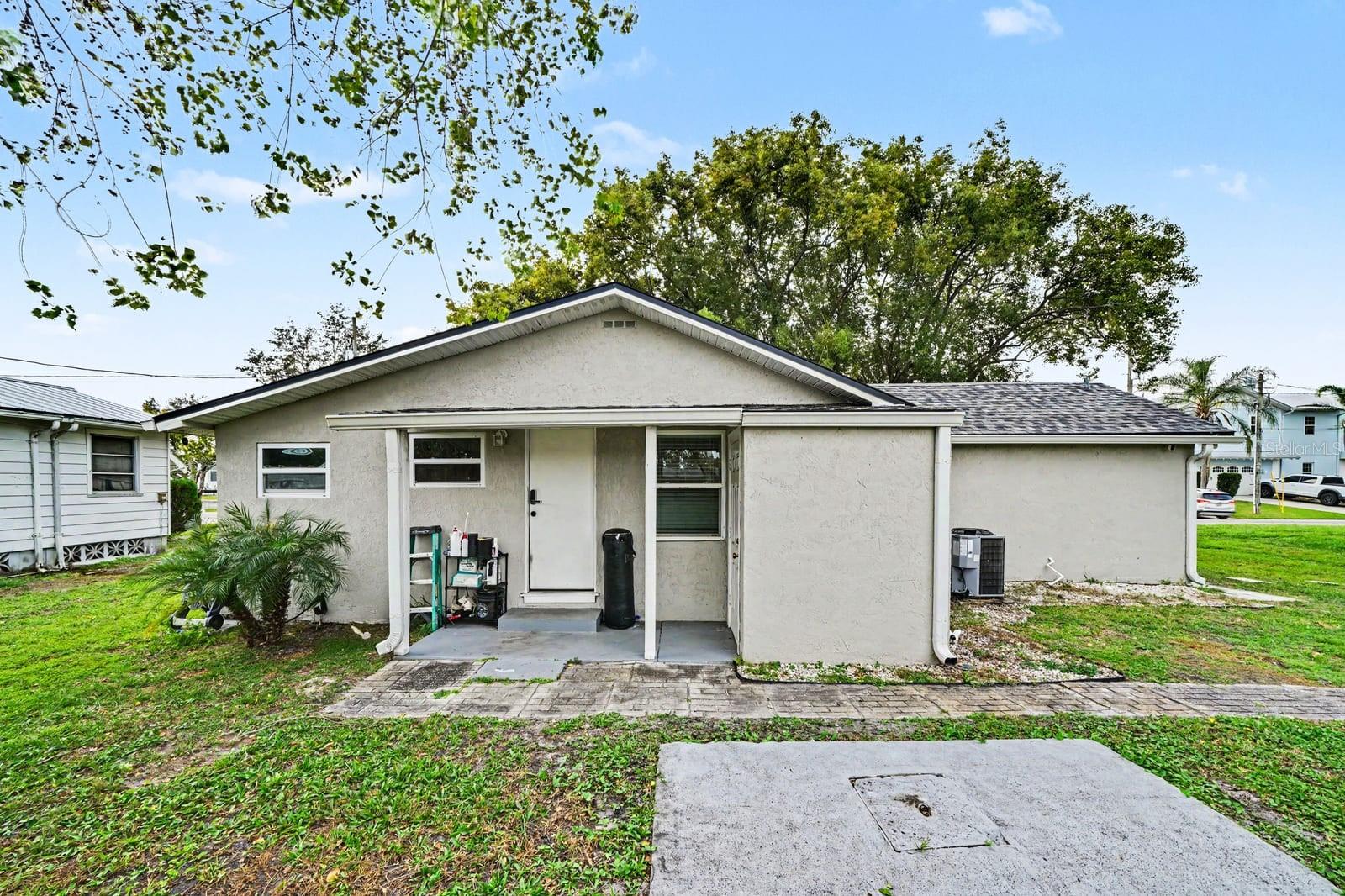 Charming single-story home with covered front porch and mature landscaping