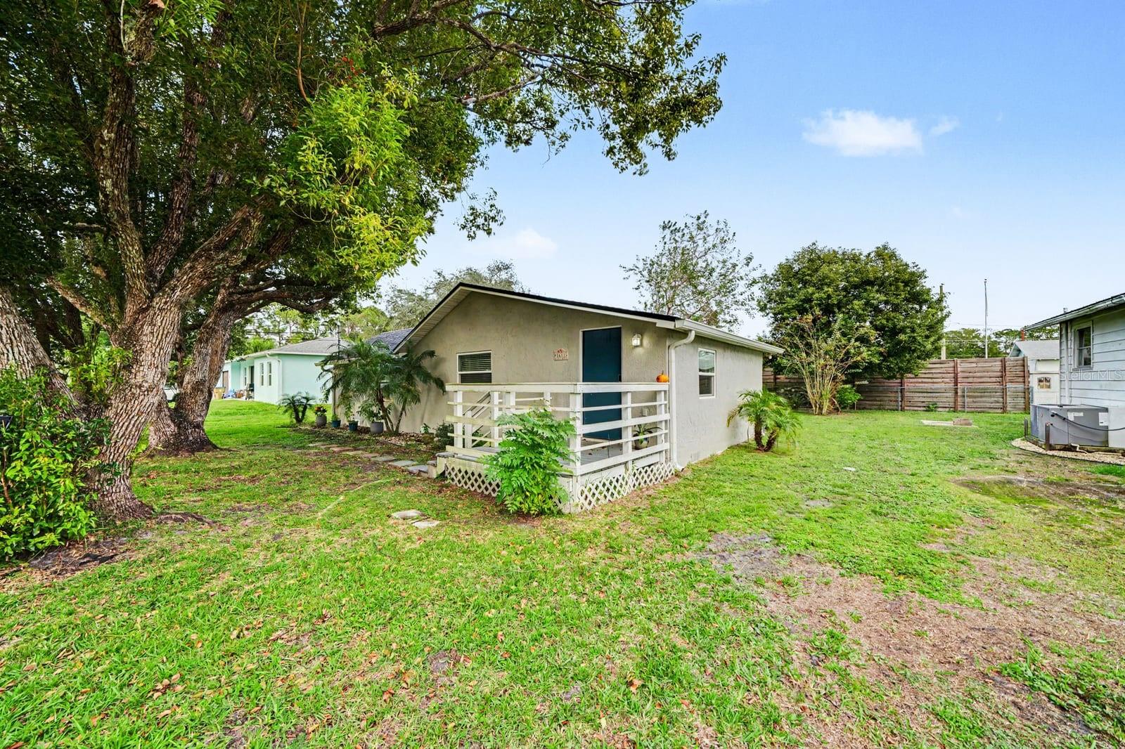Home Exterior with Mature Trees, Landscaping & Entry Deck