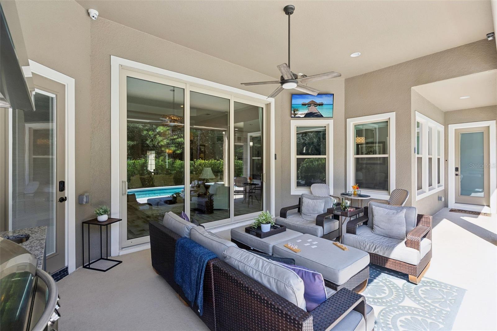 Covered lanai with remote operated screen enclosure