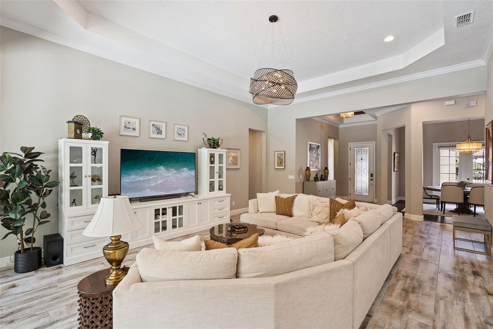 Open layout living room w/ soaring 13-ft ceilings and indoor/outdoor Florida living room