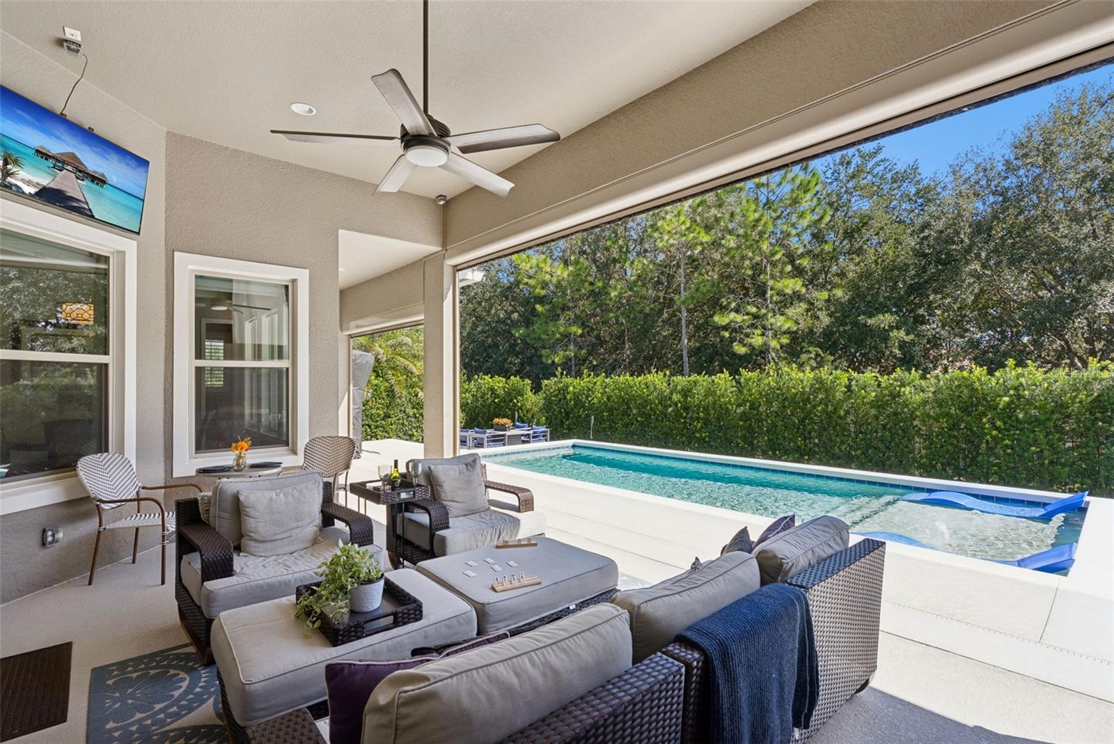 Covered lanai with remote operated screen enclosure