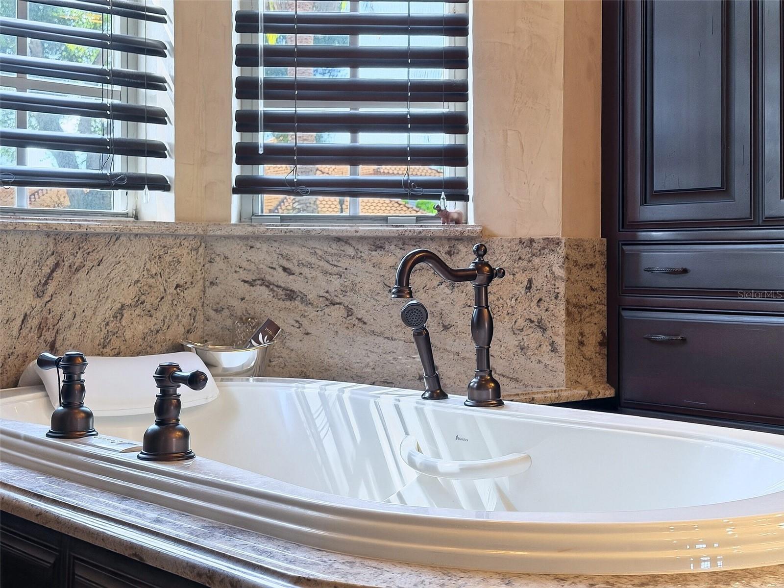 Primary bath with travertine floors