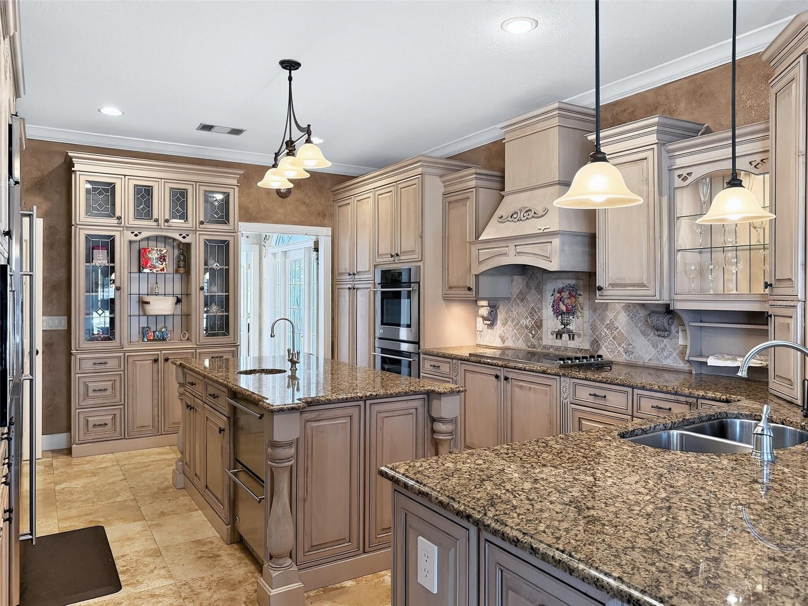 Chef's kitchen with custom cabinetry and granite