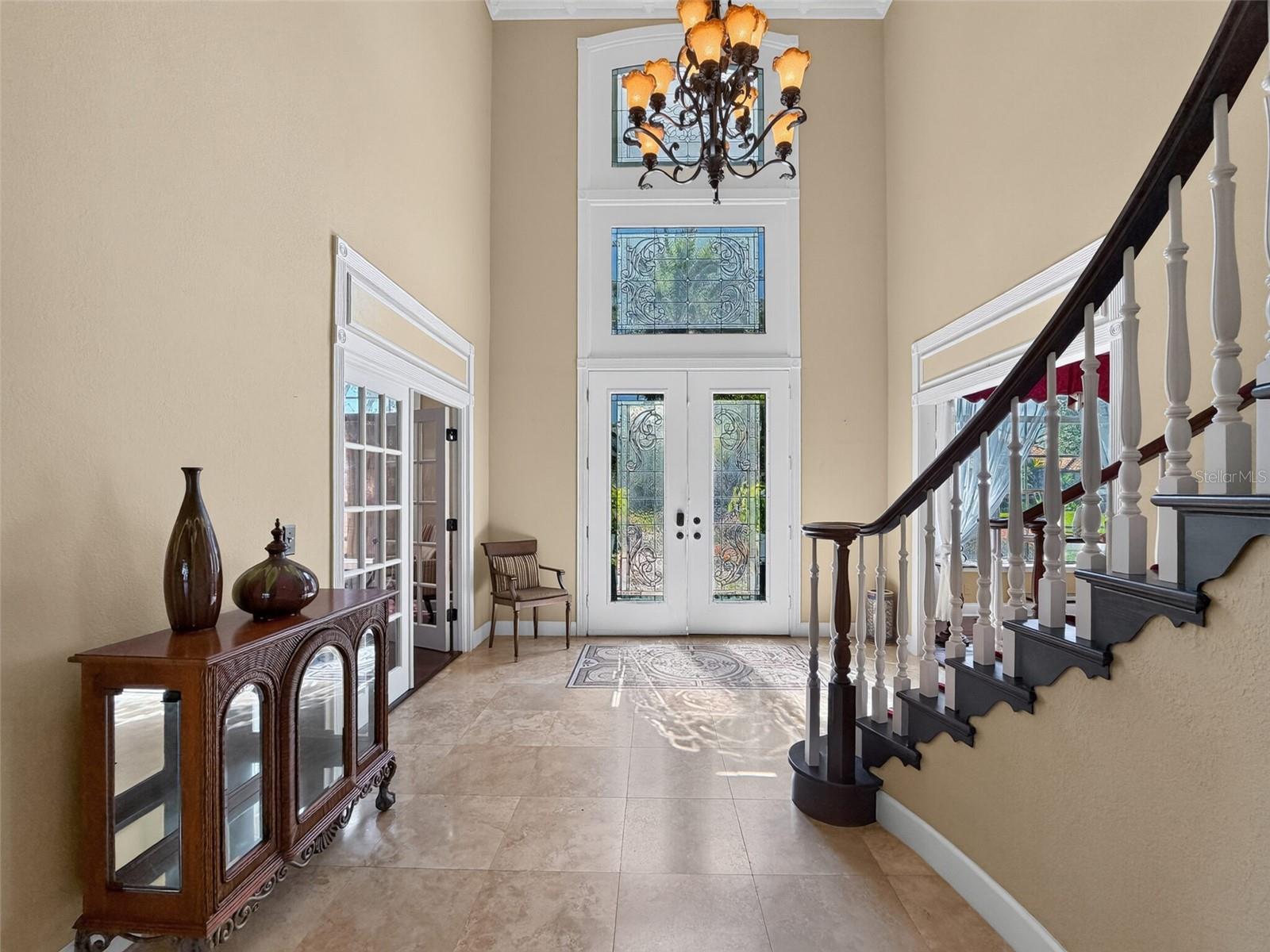 Two-story foyer with winding staircase