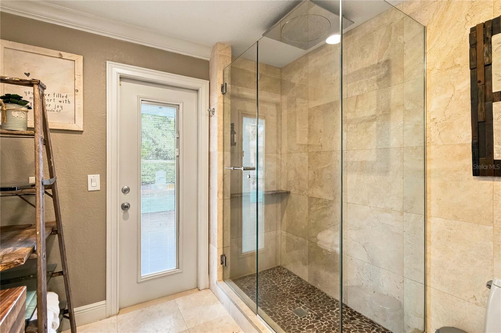 Pool Bath with direct access to pool.