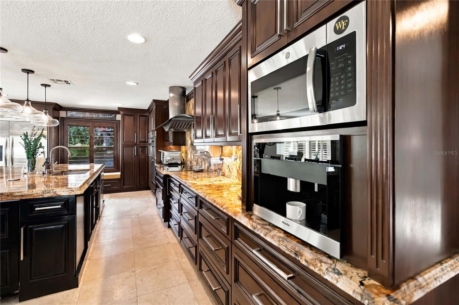 Miele Lux Coffee System with double beverage drawers in the island