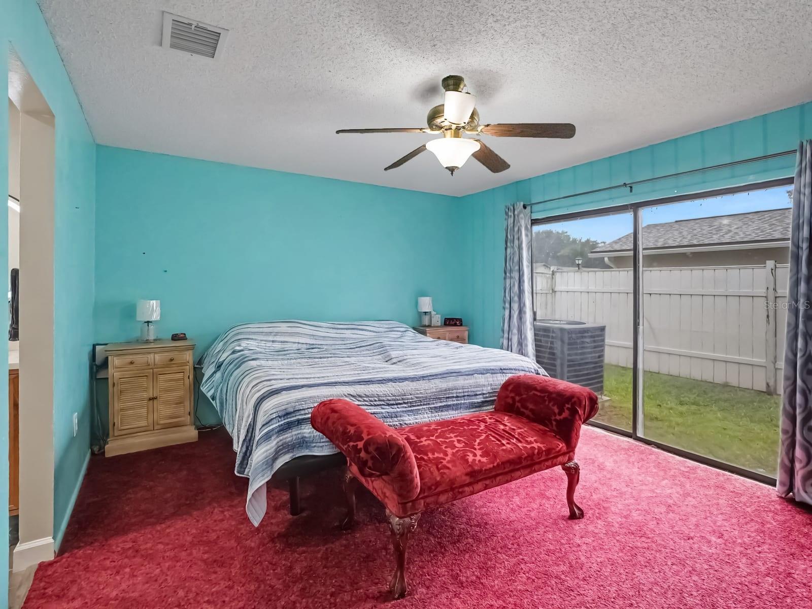 Bright Master Suite with Sliding Glass Doors to Backyard Bright Master Suite with Sliding Glass Doors to Backyard