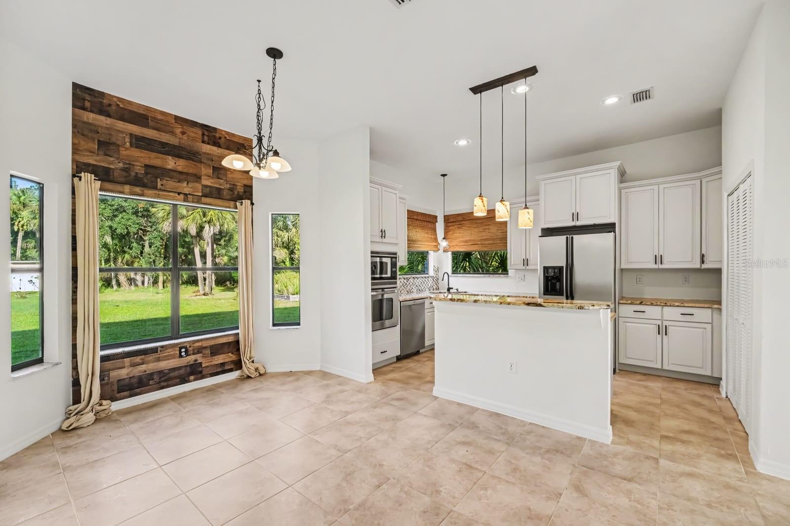 Open Kitchen & Family Room With Granite Counters, Stainless Appliances & Panoramic Views