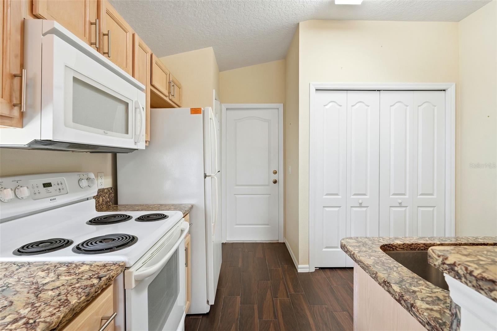 Kitchen has pantry closet and closet for washer/dryer...included!