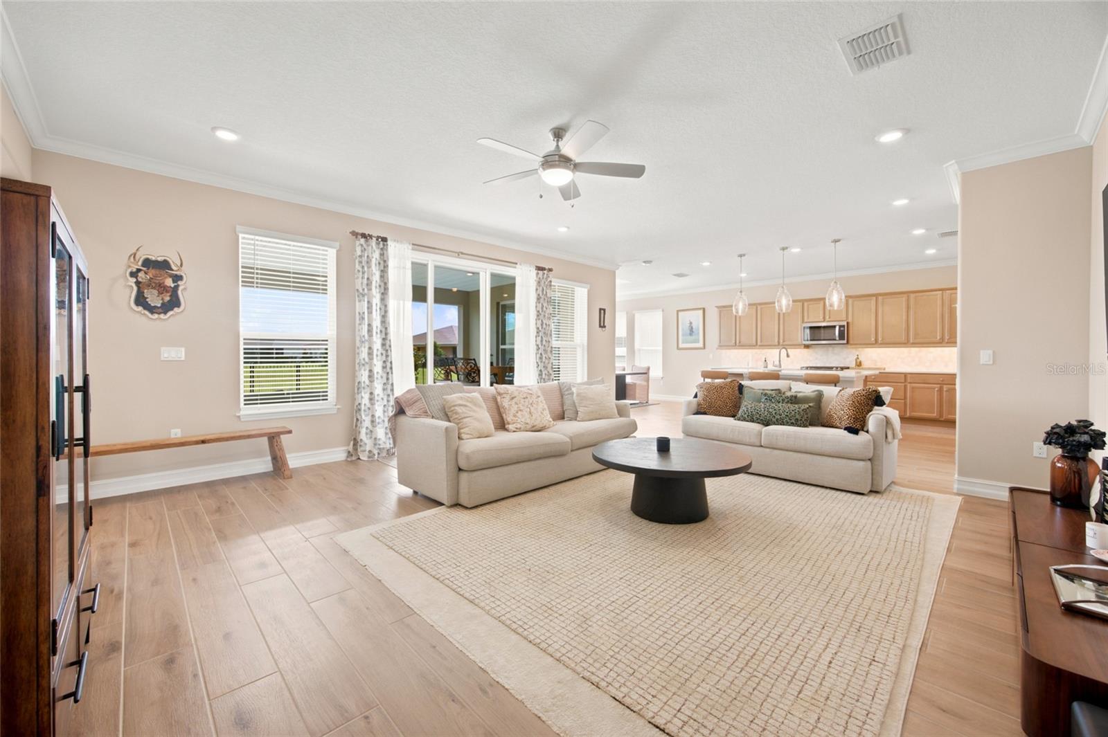 Additional living room perspective showcasing the open floor plan and sliding patio doors.