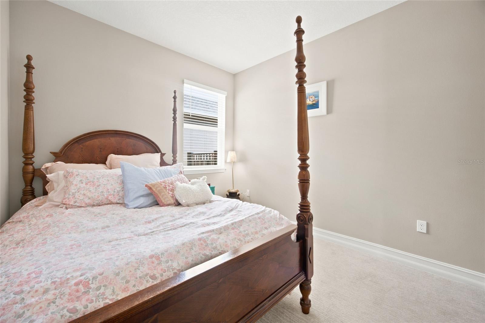 Third bedroom with comfortable proportions and a window for natural light.