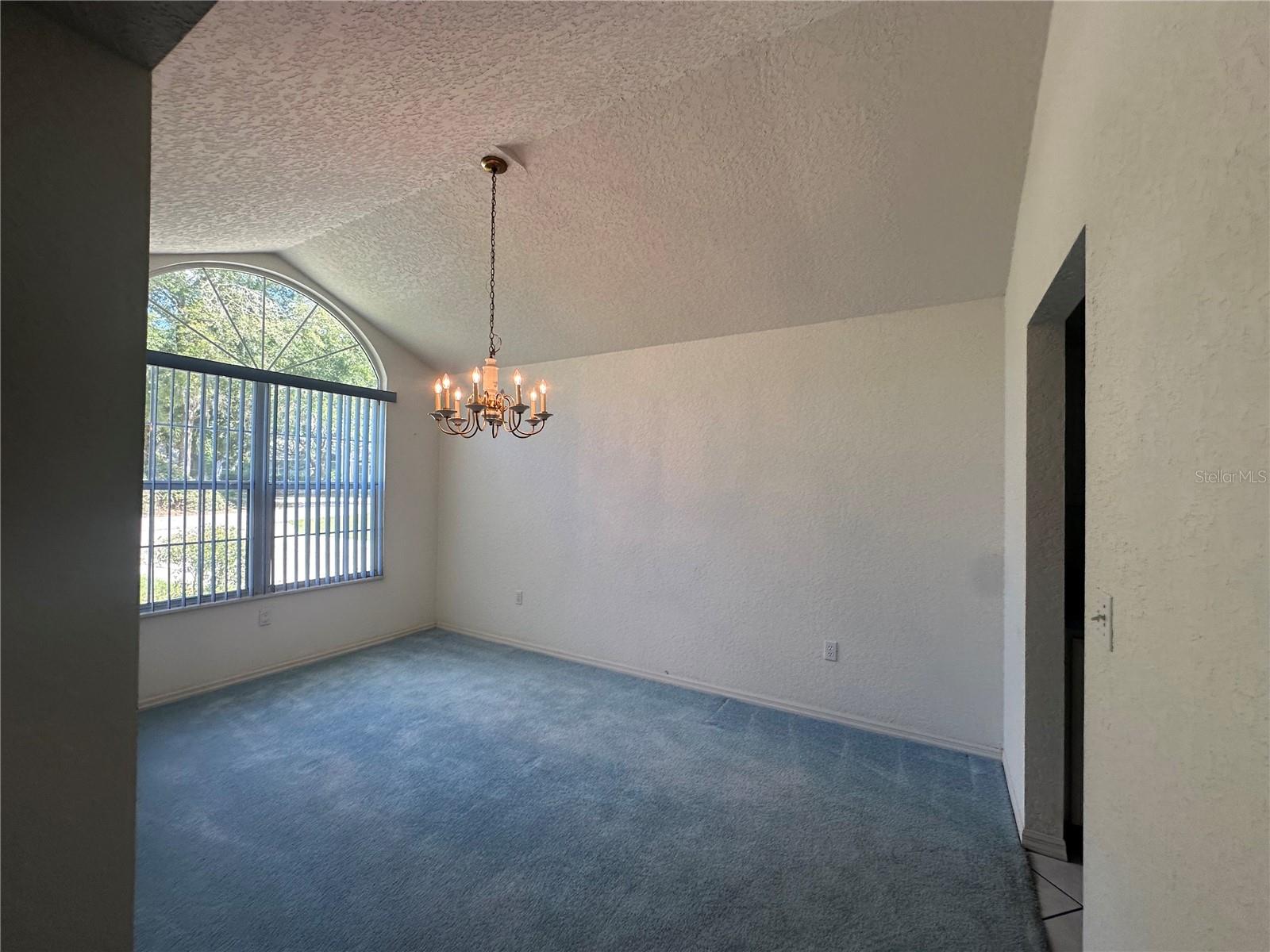 Dining Room with vaulted ceiling