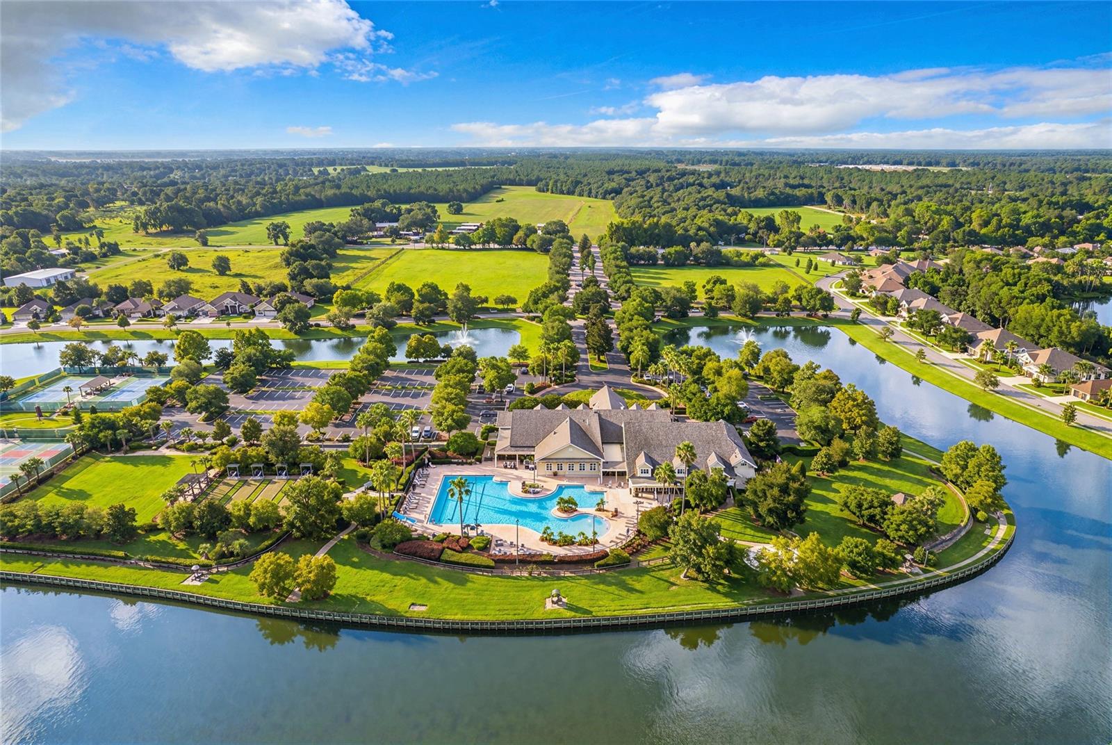 18,000 sq ft clubhouse with Olympic-size, resort-style heated pool, tennis, bocce ball and pickleball courts. Along with a hot tub, croquet lawn, basketball court, community fire pit and waterfront fitness trails.