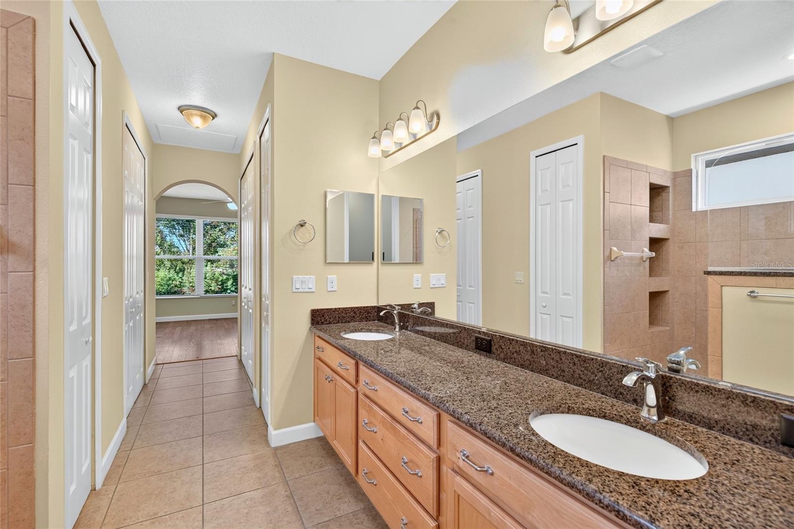 Linen closet and large walk-in closet on the left. Additional spacious closet on the right.