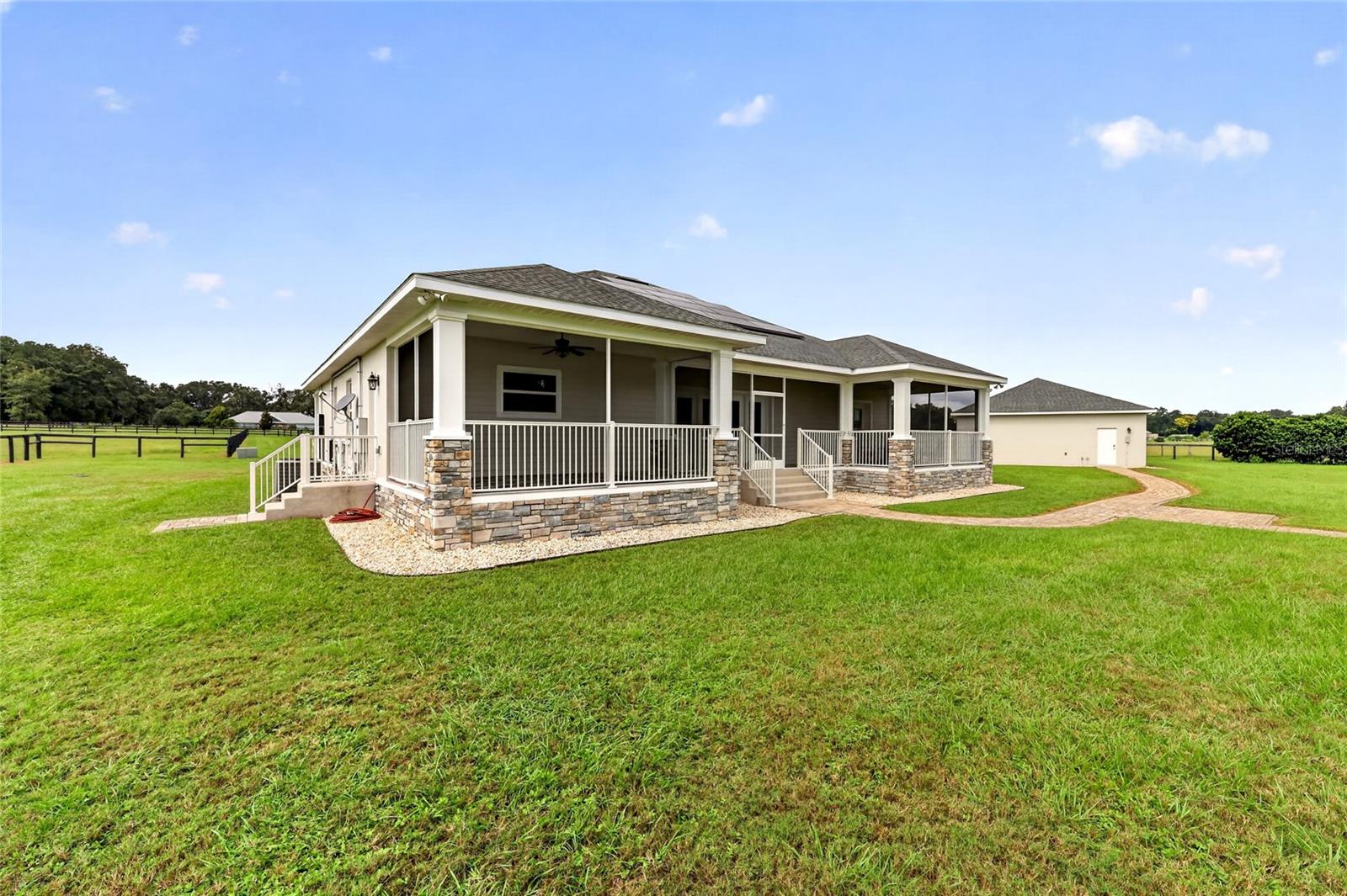 Expansive rear screened porch.