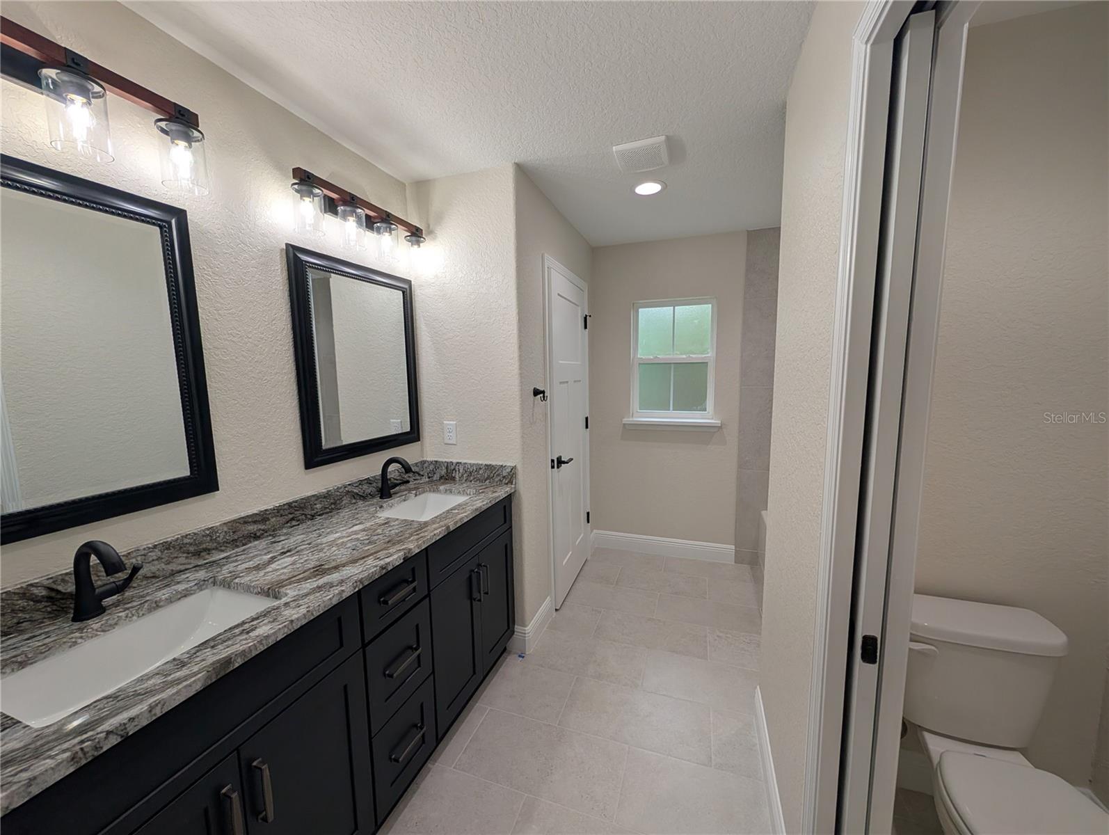 Photos are of same model  Fixtures, colors, flooring will vary