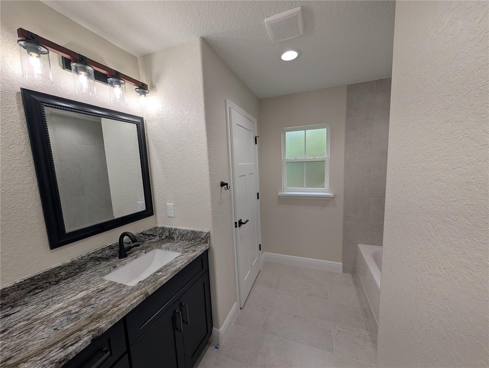 Photos are of same model  Fixtures, colors, flooring will vary