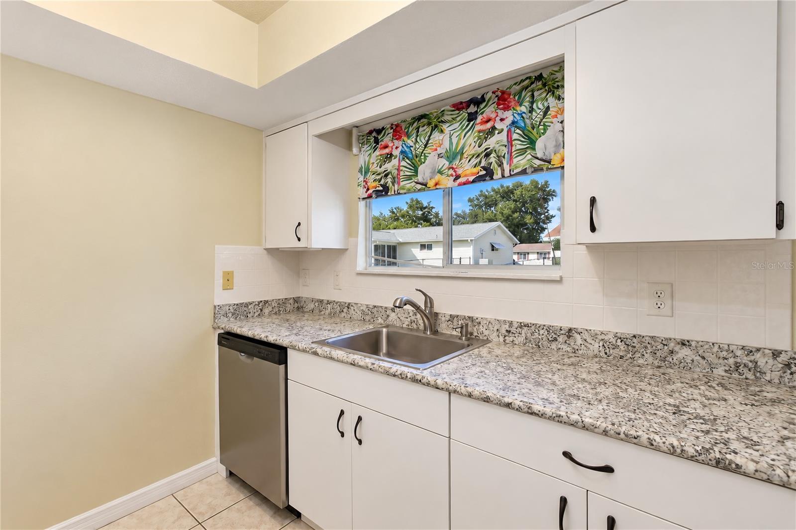 Newer dishwasher and lower soft close cabinetry & counter tops.