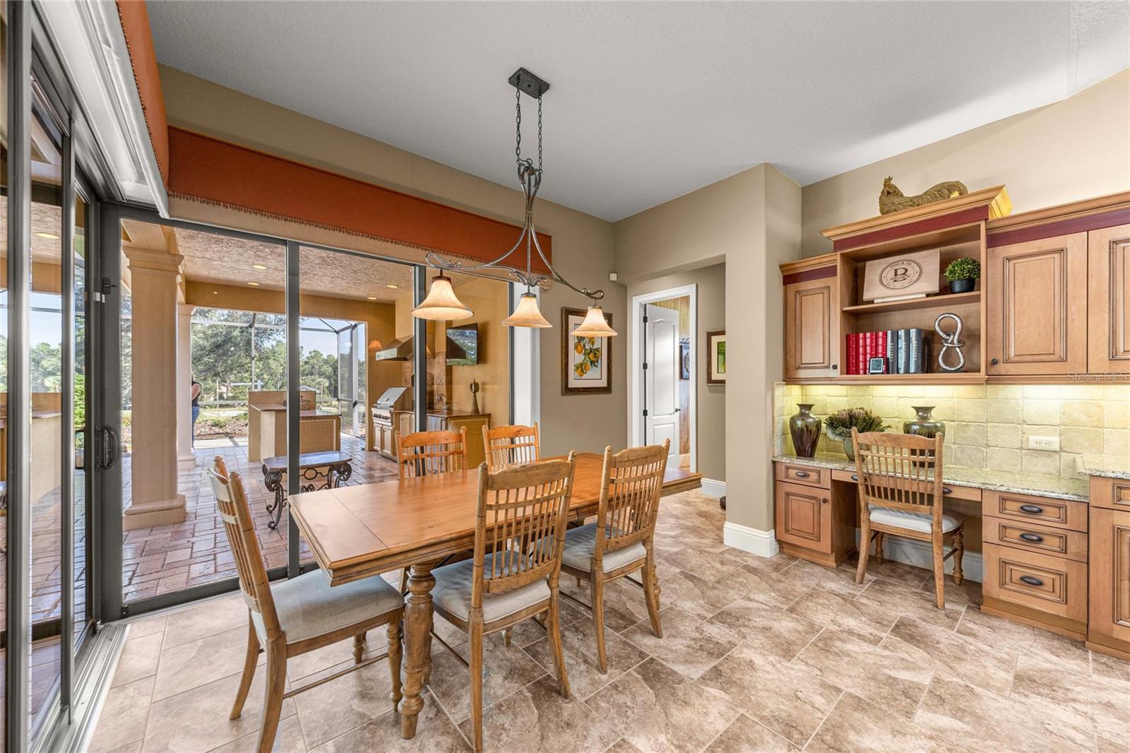 Bright dining area with corner sliding glass doors
