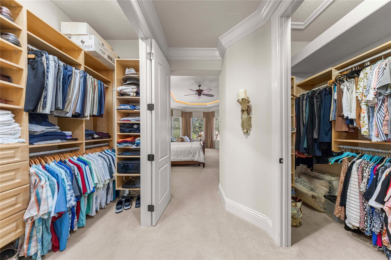 Two spacious walk-in closets with built-in shelving and storage provide exceptional organization.