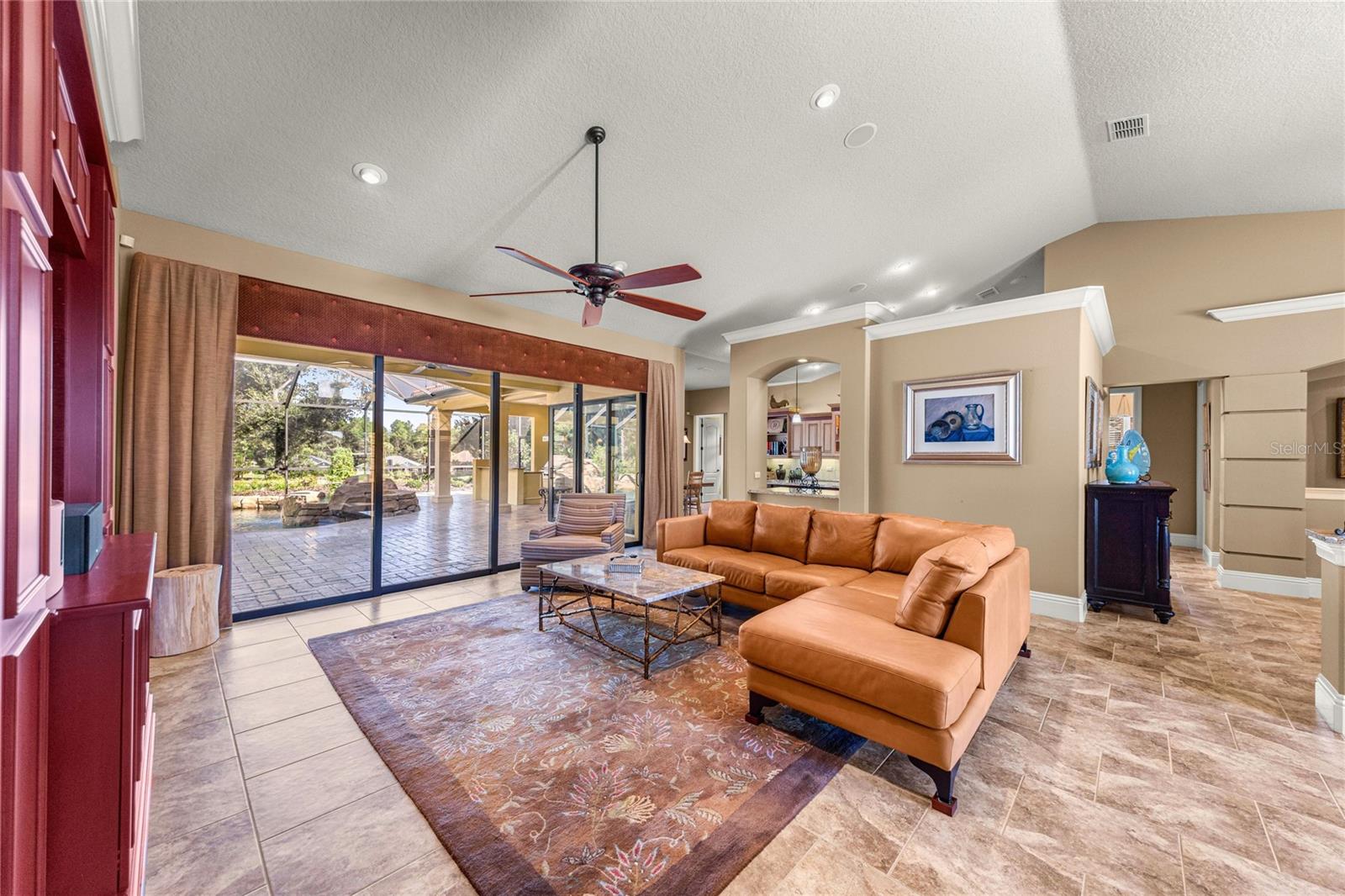 Recessed lighting, ceiling fan, and seamless across to the outdoor area. Recessed lighting, ceiling fan, and seamless across to the outdoor area.