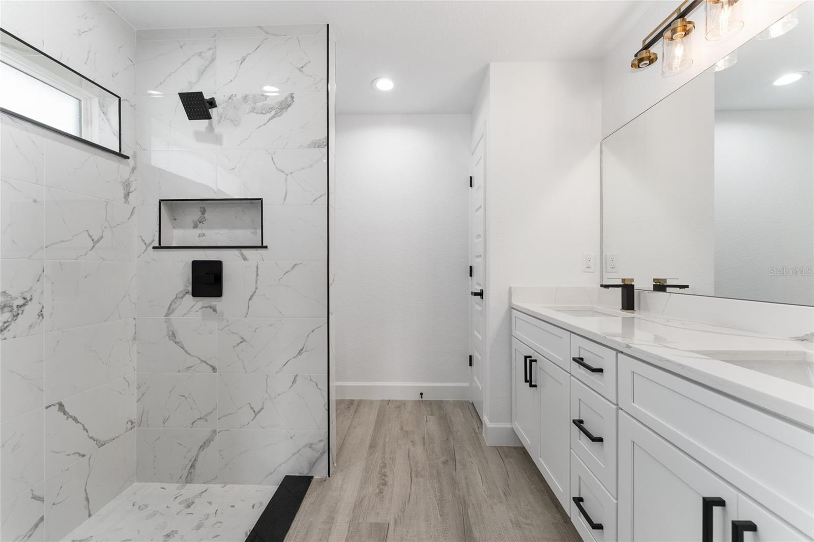 Primary Bath. Actual home will not have gold finishes, only black
