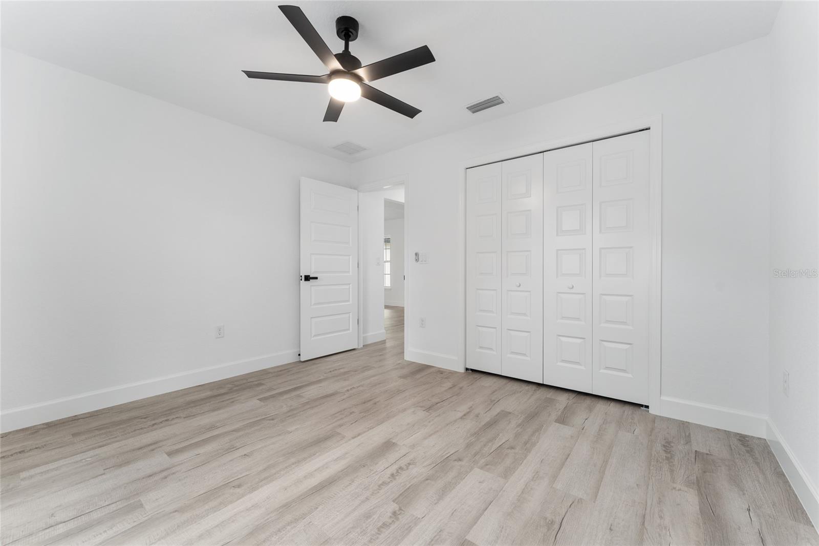 Bedroom 3. Actual home will have colonial-style interior doors versus what is shown.