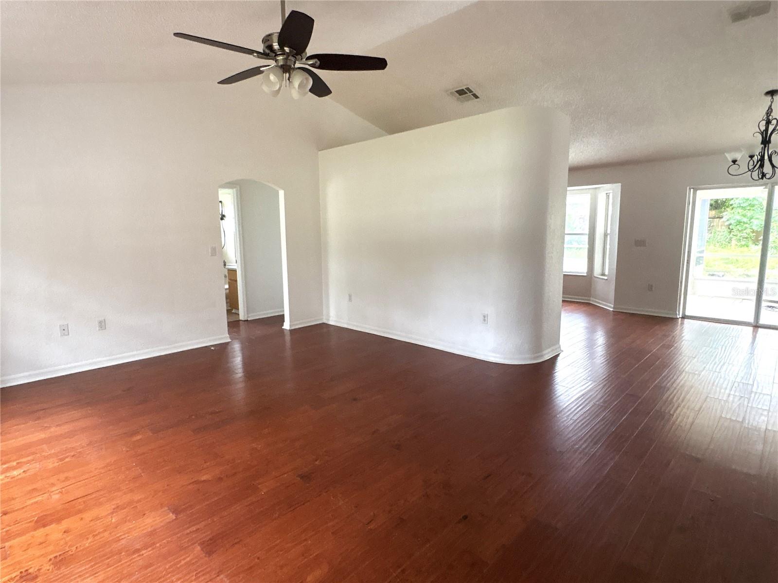 Front door area overlooking living room and access to kitchen