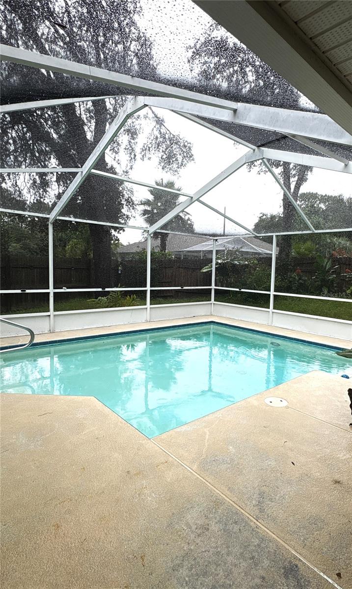 Pool screen room attached to screened and tiled lanai.