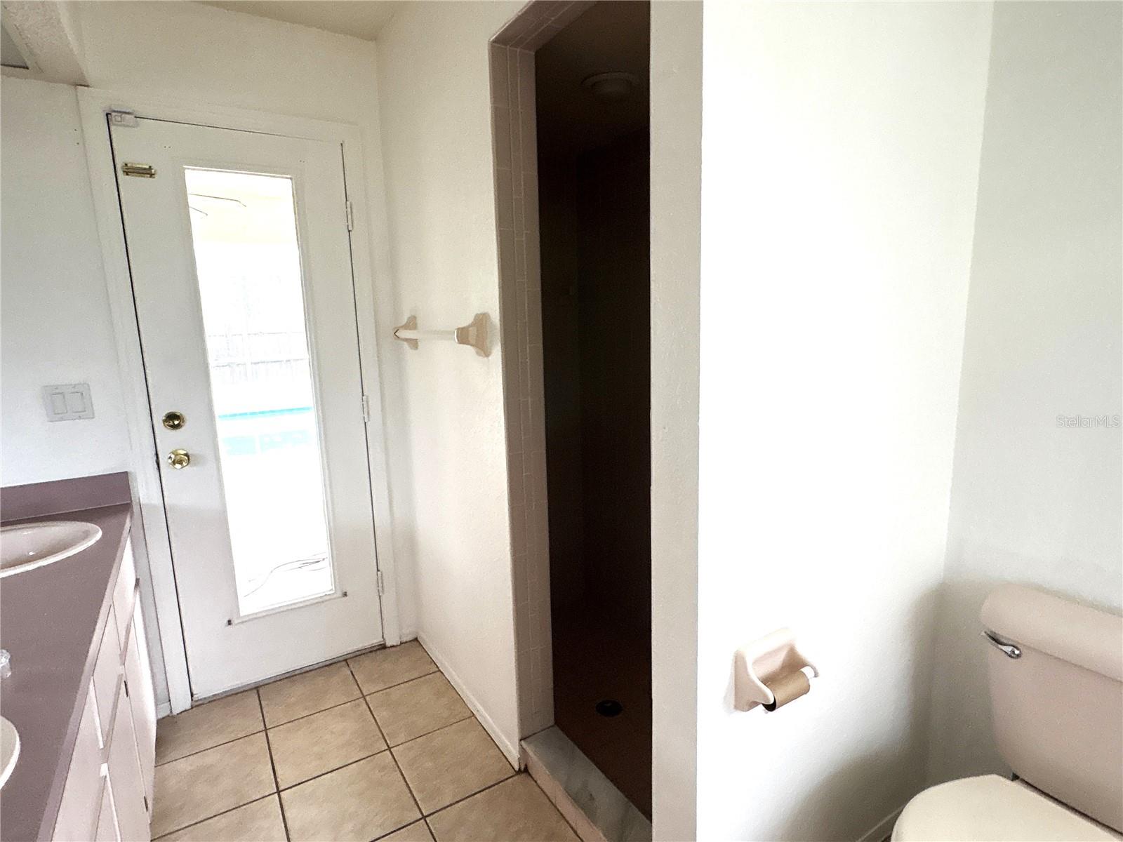 shower area with access to lanai.