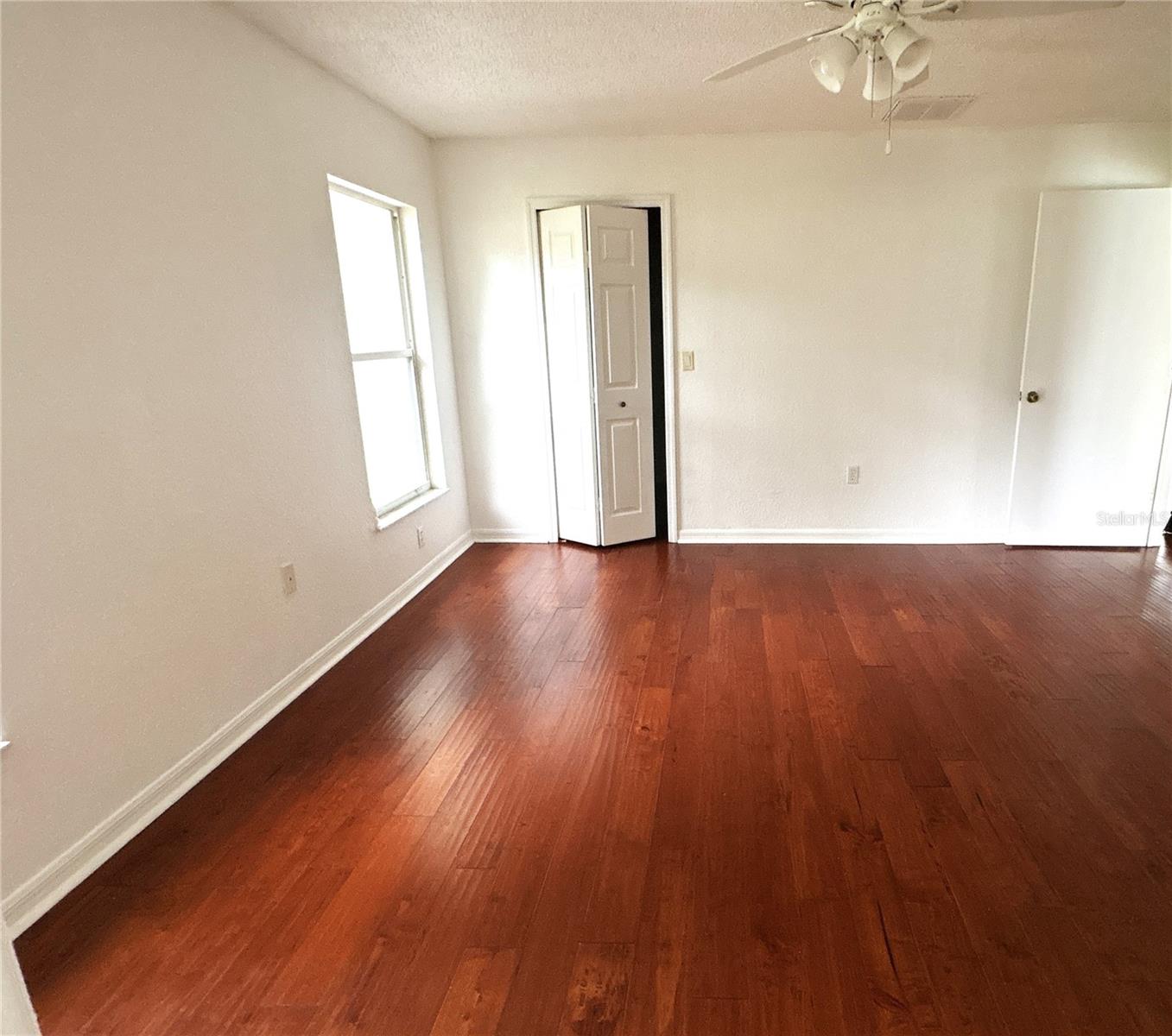 primary bedroom with walk in closet