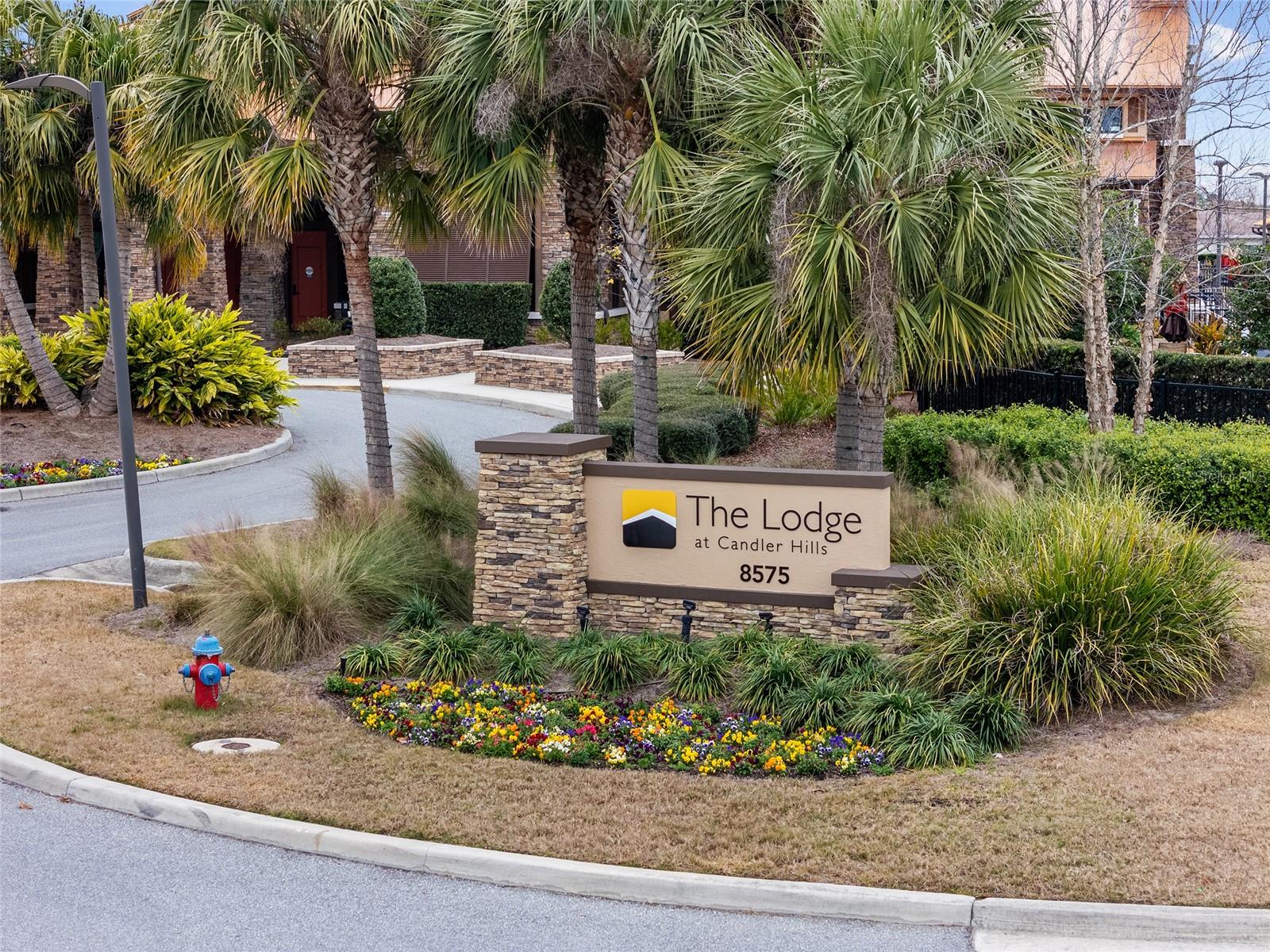 Welcome to The Lodge at Candler Hills, a beautifully appointed clubhouse offering resort-style amenities, inviting gathering spaces, a heated swimming pool, outdoor fire pit, and scenic golf course viewsperfect for enjoying an active Florida lifestyle.