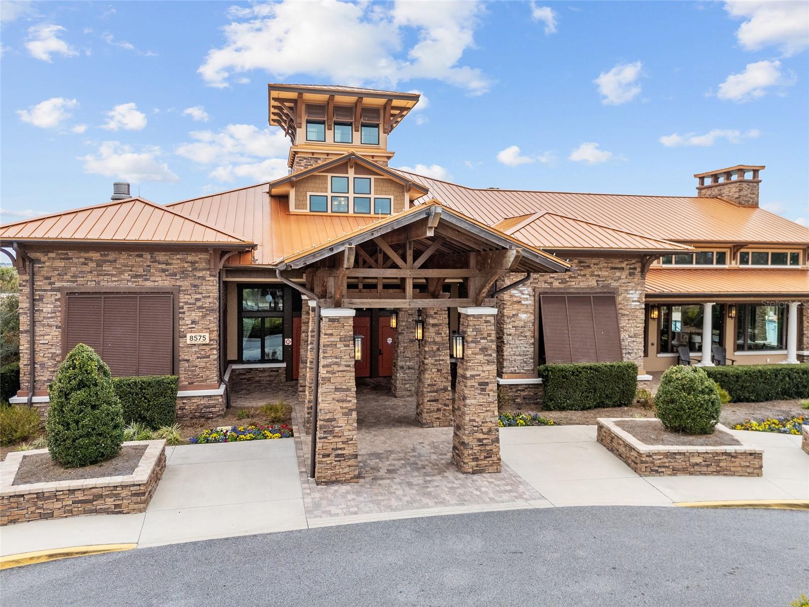 The Lodge at Candler Hills offers an exceptional resort-style experience with a beach-entry heated swimming pool, separate spa, outdoor fire pit, covered pavilion, elegant gathering lounge with gas fireplace and large-screen TV, grand lobby, expansive ballroom, multipurpose rooms, and catering kitchenproviding wonderful spaces for recreation, relaxation, and social gatherings.