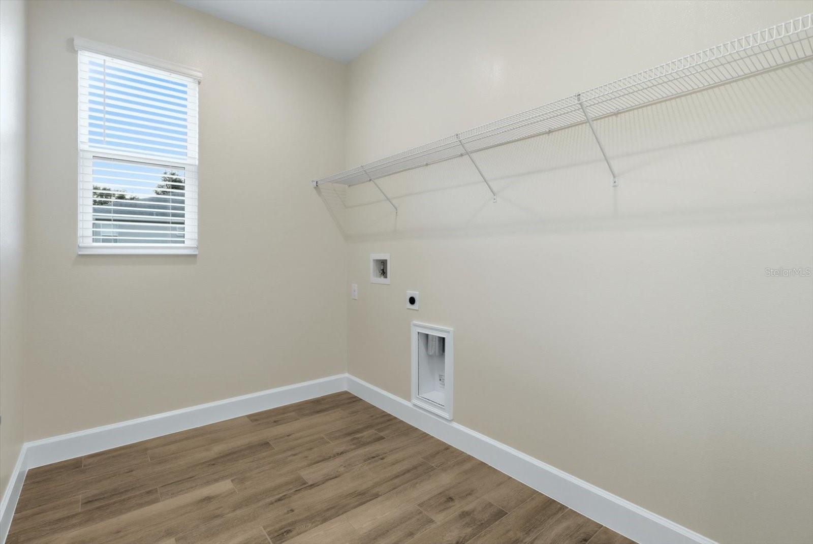 Interior Laundry room. Washer and electric dryer hookups.