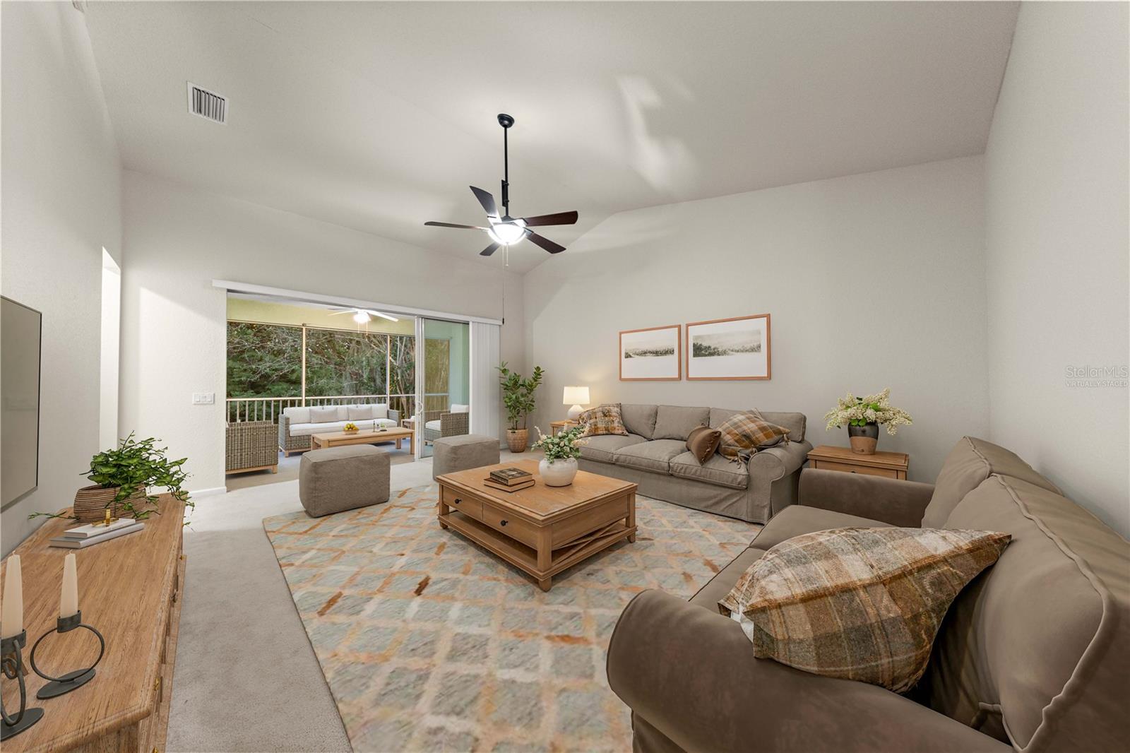 Virtually Staged. Ceiling fan, high ceilings, wooded backdrop