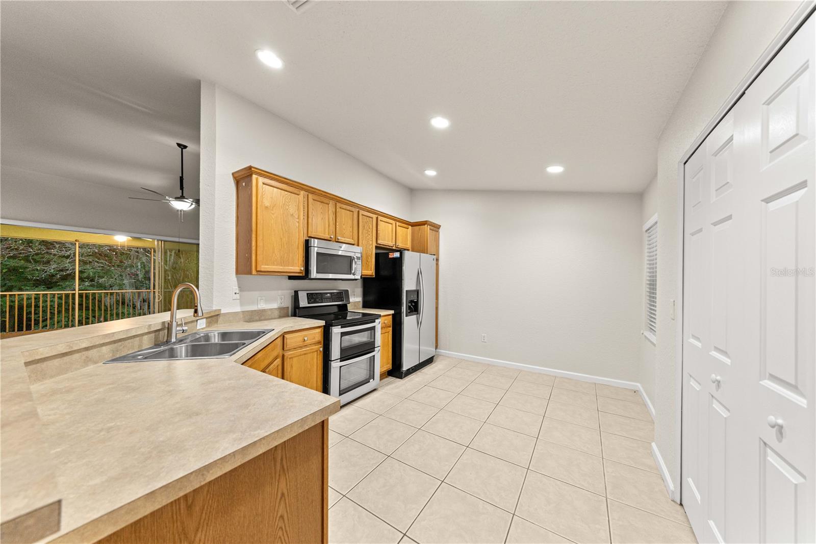 Large Kitchen with In-Unit laundry hookups and overlooks Living Room and features a double oven!